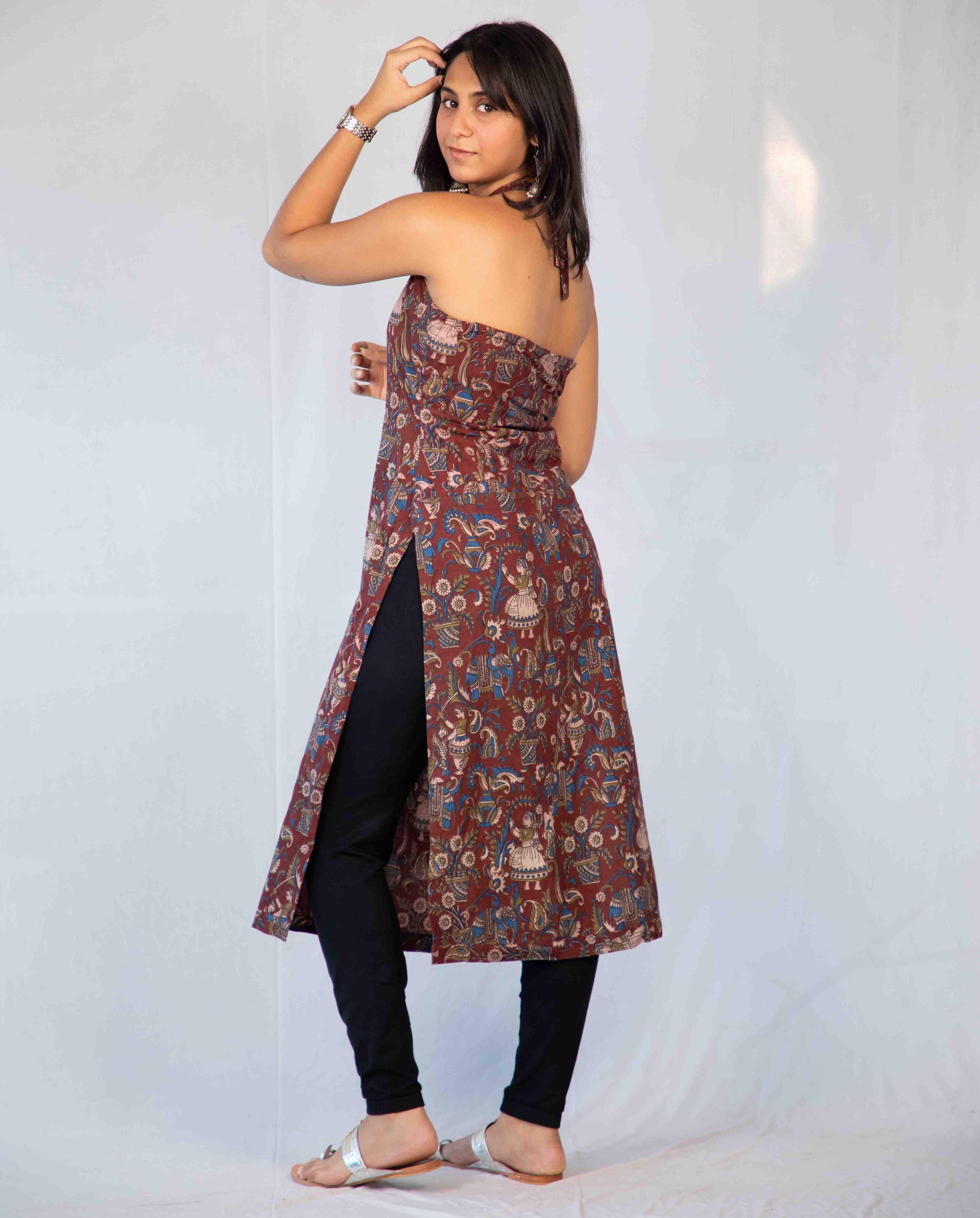Woman wearing a floral dress with a plain background